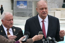Former Arizona state Sen. Russell Pearce, left, and Arizona Attorney General Tom Horne defend Proposition 200 on the steps of the Supreme Court. Horne said that states have the burden of ensuring that voters are citizens, and the Arizona law makes that possible.