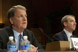 US Airways CEO Doug Parker, left, and American Airlines CEO Thomas Horton at a March hearing, in which they told senators a merger of their airlines would benefit consumers. The two airlines vowed a 