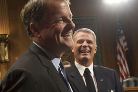 US Airways CEO Doug Parker shares a laugh with several pilots after testifying before a Senate subcommittee on the merger of US Airways and American Airlines. US Airways headquarters, now in Tempe, would move to Texas as the new American Airlines.