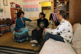 Antonia D'orsay, left, executive director of This Is How, talks with residents of the Regina House, a home for transgendered people.