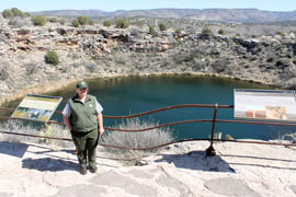 Park ranger Amy Fulkerson stands in front of Montezuma Well, a collapsed limestone cavern that is part of Montezuma Castle National Monument in the Verde Valley.