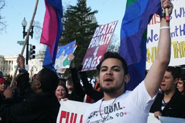 Alex Rangel of the gay-rights group GetEQUAL leads a rally in front of the Supreme Court this week, as the court considered cases dealing with gay marriage. An Arizona case dealing with benefits for domestic partners is pending while the court considers the other cases.