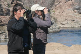 Jean Marie Spilker, right, and Lisa Helgren keep an eye on a bald eagle next near Apache Junction as part of the Arizona Bald Eagle Nestwatch Program.
