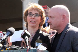 Former U.S. Rep. Gabrielle Giffords addresses a news conference at which she and other victims of the 2011 mass shooting in Tucson called for universal background checks on gun buyers.