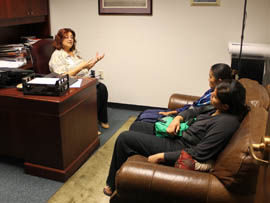Jaime Lynn Butler (in blue), with her sister, Shelby Nez, meets with Rep. Rosanna Gabaldon, D-Sahuarita, during a visit to the State Capitol in March.