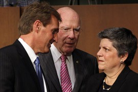 Sens. Jeff Flake, R-Ariz., and Patrick Leahy, D-Vt., from left, greet Homeland Security Secretary Janet Napolitano before she testified to the Senate Judiciary Committee on a comprehensive immigration-reform bill that Flake helped craft.