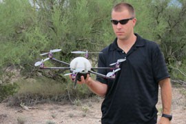 Matt Culbertson shows off the Cyclone 6, a drone developed by Cyclone Autonomous Design group in Tucson for possible use in law enforcement. An expected boom in such small drones for civil use has colleges vying to offer degrees in design, marketing and operation of such aircraft.