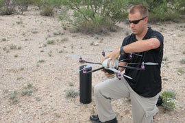 Matt Culbertson of Tucson's Cyclone Autonomous Design group opens the company's Cyclone 6 unmanned aircraft, or drone, in preparation for deployment.