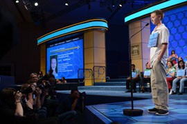Christopher O'Connor, 13, of Tucson takes the stage for the semifinals of the National Spelling Bee in Washington. O'Connor was the first to compete Thursday and the first one out, but he's already planning a return next year.