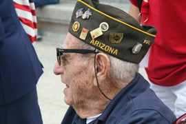 An Arizona veteran shows his colors during a D-Day anniversary visit to the World War II Mmeorial in Washington.
