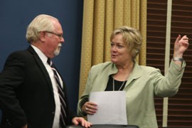 Quik Mart Stores Vice President Shelly Little-Gibbons speaks with Rep. Ron Barber, D-Tucson, before a House Small Business Committee hearing. She testified that her family business, founded in 1965, struggles to compete against larger firms but is still growing steadily.