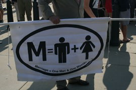 Not all of those outside the Supreme Court were supporters of same-sex marriage, as the man holding this banner shows. But the number of opponents was small and there were no confrontations between the two sides.