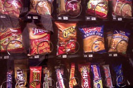 Some officials worry that the stricter nutrition requirement for school snacks will hurt vending machine sales, which provide revenue for some school operations. The new rules will apply to snacks sold in a cafeteria, vending machine or elsewhere in school.
