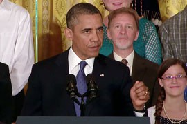 President Barack Obama, backed by several dozen people he said have benefited from health care reform, made a renewed case for the law as the House voted to delay key parts of it.