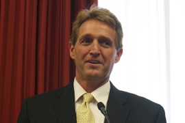 Sen. Jeff Flake, R-Ariz., who spoke in front of faith leaders who were on Capitol Hill to push for immigration reform, paused to pray after the meeting.