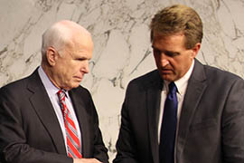 Arizona Sens. John McCain, left, and Jeff Flake confer before Tuesday's hearing by the Senate Foreign Relations Committee at which administration officials urged congressional approval for action against Syria.
