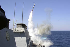 The guided missile destroyer USS Porter launches a Tomahawk toward Iraq during the initial stages of 