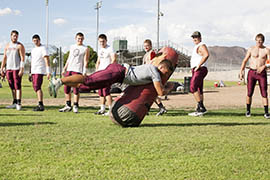 Mountain Ridge High School's football drills include instruction on reducing the chances of suffering a concussion.