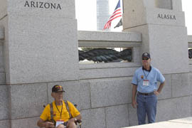 Army veteran and Fountain Hills resident Bill Dugger poses for a photo in front of the Arizona state column at the National World War II Memorial in Washington, D.C., as Honor Flight chaperone Rick Sherrill looks on.