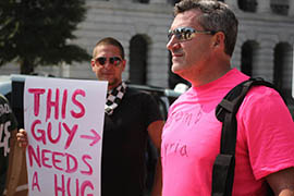 Not everyone in pink is anti-war: A supporter of U.S. military action against Syria confronts Code Pink protesters on Capitol Hill in a 