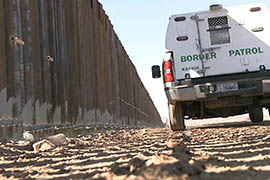A Border Patrol vehicle rides the border fence near Douglas, Ariz., in this 2012 file photo. Apprehensions of illegal immigrants have fallen sharply in Arizona in recent years, the agency said.