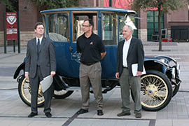 From left, Phoenix Mayor Greg Stanton, Luis Gonzalez of the Arizona Diamondbacks and Will Toor, director of transportation programs for the Southwest Energy Efficiency Project, stand in front of a 1915 electric vehicle belonging to APS.