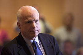 U.S. Sen. John McCain addresses a crowd of 200 during a town hall meeting Thursday in Syria.
