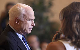 U.S. Sen. John McCain listens to an audience member Thursday during a town hall at which Syria was the most popular topic.