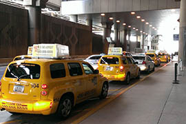 Taxis line up at Phoenix Sky Harbor International Airport. A state law taking effect this week will require drug testing for drivers when hired or engaged as contractors and each year after that.