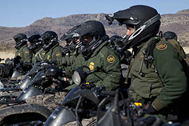 Border Patrol agents line up in formation on motor bikes in the Tucson sector.