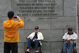 Veterans with Honor Flight Southern Arizona pose for a photograph at the World War II Memorial Monday.