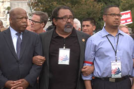 Democratic Reps. John Lewis of Georgia, Raul Grijalva of Tucson and Keith Ellison of Minnesota link arms prior to being arrested outside the Capitol as part of a rally in support of comprehensive immigration reform.