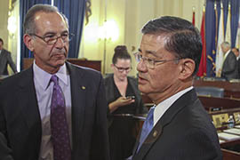 Howard Somers talks with Veterans Affairs Secretary Eric Shinseki after a House committee hearing in Washington. Somers and his wife do not think the department does enough to help veterans with mental health and suicide issues.