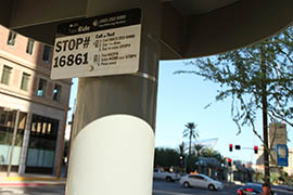 Valley Metro signs allow commuters to learn when the next bus will arrive through text message.