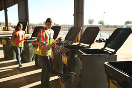 Arizona State University student Melissa Merrick sort trash into some of the 44 bins use for a study by ASU's School of Sustainability.