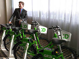 Phoenix Mayor Greg Stanton shows off bicycles that will be part of the city's sharing program dubbed GRID Bike.