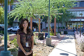 Becky Zusy, Mesa's conservation specialist, shown in a newly xeriscaped area outside city offices, said the financial incentive the city's rebate program offers often changes people’s minds.