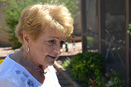 Jeananne Pastin surveys her lawn's new xeriscaping.