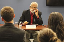 The Rev. Javier Avila tells a George Washington University forum on cross-border gun trafficking of the need for society as a whole, not just government, to tackle the problem of gun violence in his home country of Mexico.