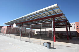 A shade structure over the playground at Sunnyslope Elementary School in Phoenix houses some of the 1,416 solar panels the school had installed through an APS incentive program.