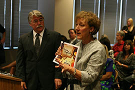 As Indiana Attorney General Greg Zoeller listens, Abby Kuzma, an Indiana deputy attorney general, addresses the Governor’s Task Force on Human Trafficking in September. Kuzma said efforts by group and elected leaders led to laws and policies to address sex trafficking before Indianapolis played host to the Super Bowl.