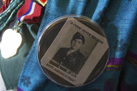 Tribe members wore buttons featuring photos of code talkers, such as this one of Marlinda Kooyaquaptewa's late father Warren.