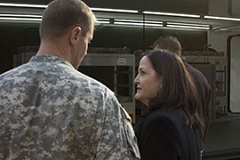 Army Assistant Secretary Katherine Hammack talks to an officer during a Pentagon demonstration of a portable, deployable, rigid-wall shelter system under development by the Army.
