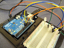 Robert Rubio assembled wires on this Arduino circuit board to make a light glow blue and green.