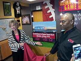 Sherry Henry, executive director of Arizona Office of Tourism, and Terry Williams, sales and service manager for the Glendale Convention and Visitors Bureau, address a news conference counting down to the 2015 Super Bowl in Arizona.
