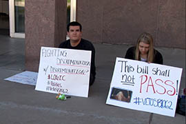 Demonstrators make their feelings known to lawmakers Monday.