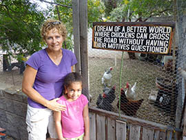 While the zoning for Denise Phillips' Chandler property allows chickens, a city ordinance forbids them in the yards of most other homes. She's shown here with her goddaughter, Phoebe Brethrower.