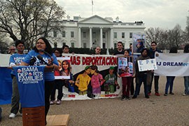 Dozens of immigration advocates, including several from Airzona, rallied outside the White House to repeat demands that President Barack Obama stop deportations of people here illegally until a reform bill can be passed.
