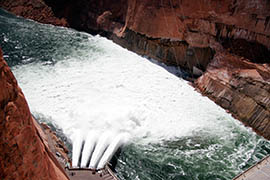 Outlet tubes at Glen Canyon Dam send water out of Lake Powell and down the Colorado River.