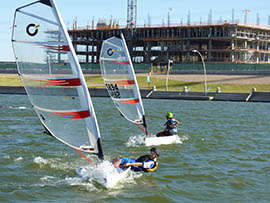 Two high schoolers navigate Tempe Town Lake during sailing lessons offered by the Arizona Sailing Foundation.